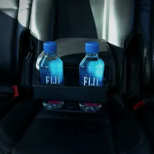 Chilled bottled water in the rear armrest